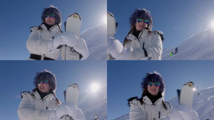 在一个阳光明媚的冬日，一名年轻女子在阿尔卑斯山的一个冰川滑雪胜地用她的滑雪板跳舞