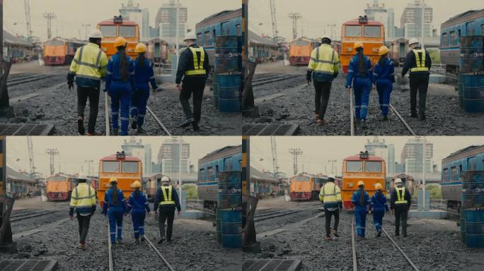 专业列车技师在繁忙车站通力合作修理铁路设备——交通维修的职业多样性。