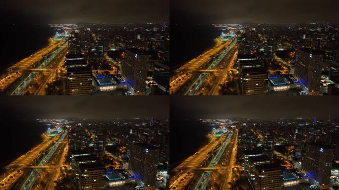 夜间照明巴塞罗那城市湾现代住宅综合体交通道路航拍全景4k西班牙