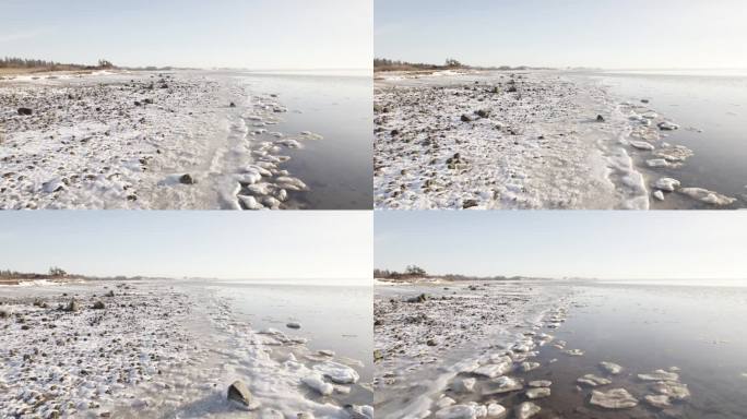 空中无人机拍摄的冰冻湖岸和拉古纳湖在白天