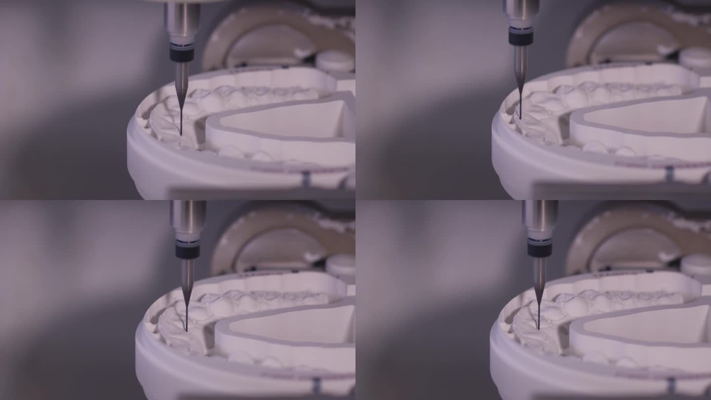 数控牙铣床在牙科实验室中雕刻出人工牙的形状。