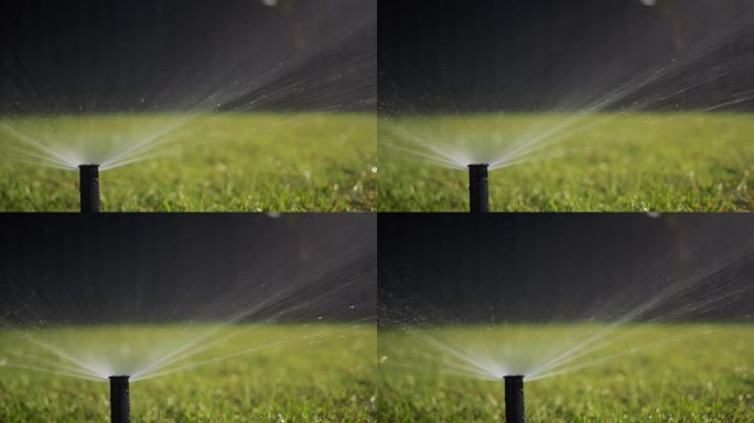 滑杆击球:一股水流在压力下灌溉果岭。