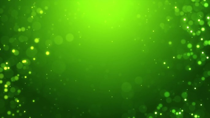 闪闪发光的粒子中心空闪亮的绿色环背景