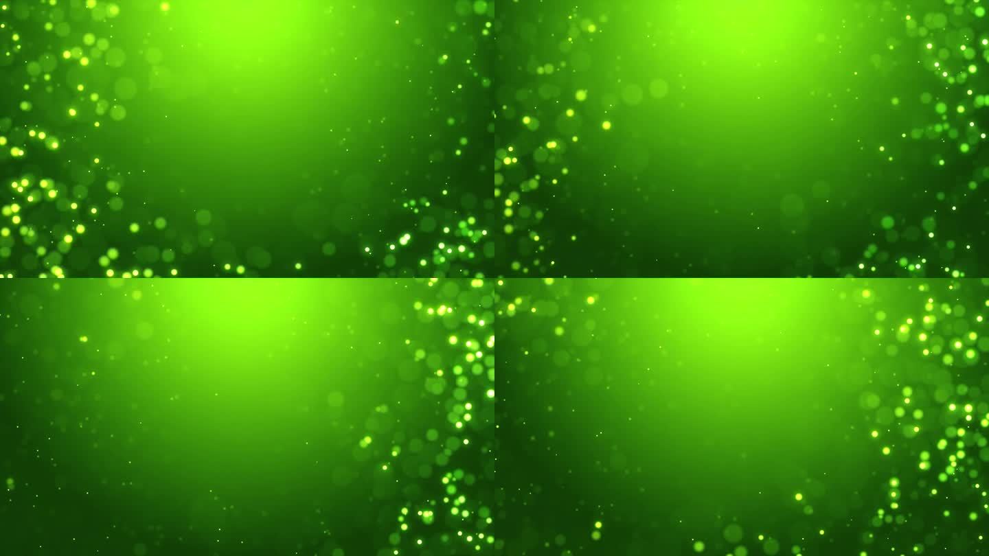 闪闪发光的粒子中心空闪亮的绿色环背景