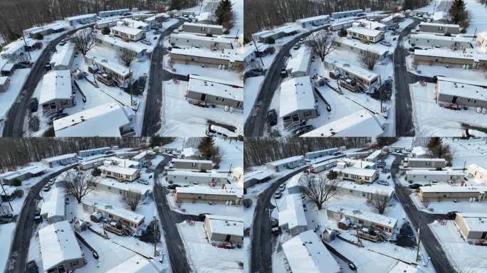冬雪覆盖了农村活动房屋拖车公园。住宅住房与农村贫困、家庭取暖公用事业主题。鸟瞰图。