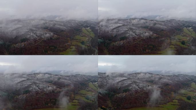 在雪山上空飞行时，无人机在一场暴风雪中揭示了云层下的霜冻地形。