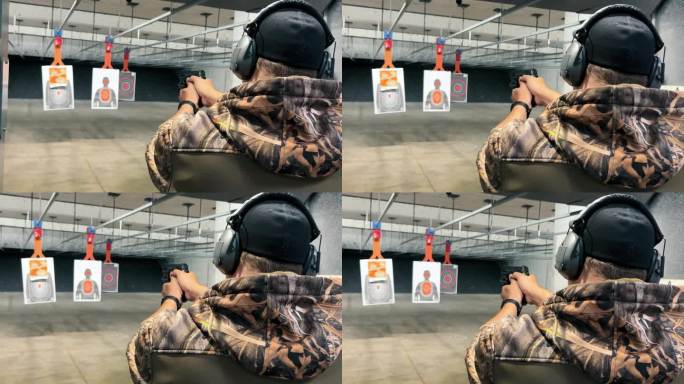 在室内靶场练习射击的人，穿着迷彩服的人在射击场用手枪瞄准目标，注重精确度和安全性。