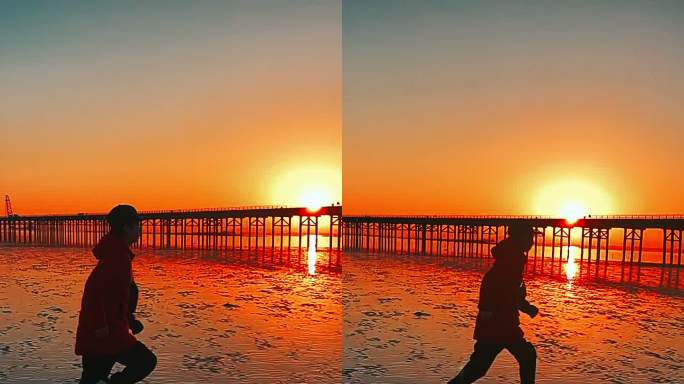 冬日日出在厦门海滩上奔跑的阳光少年日落