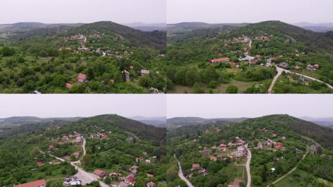 在保加利亚的一个乡村，接近的无人机在Tsarichina Hole村附近拍摄，显示了周围的丘陵和山脉