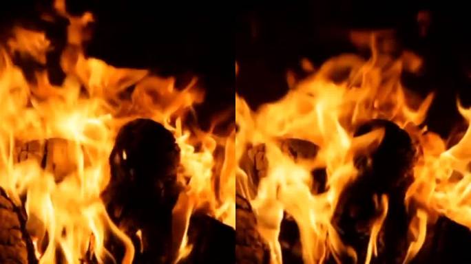 砖房壁炉里燃烧的柴火的垂直特写镜头