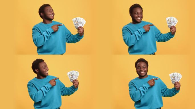 快乐的非洲人现金钱美元球迷享受成功彩票赢得财务富足孤立的橙色