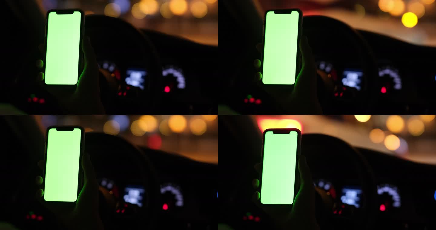 绿屏的手机在夜晚的汽车车内驾驶室里