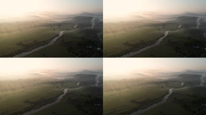 日出的小河在有山脉的山谷里
