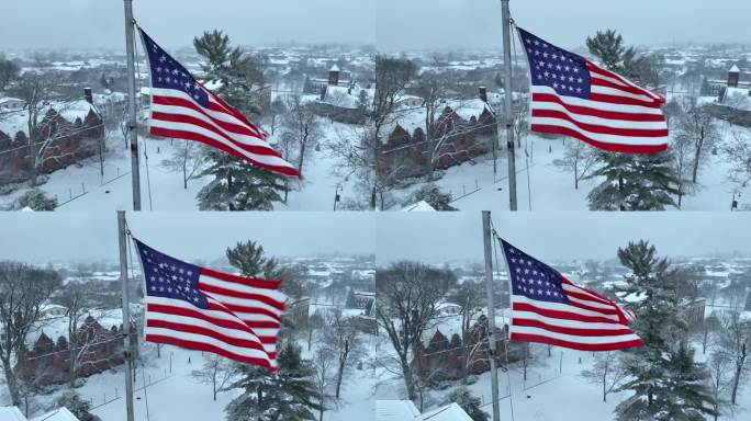 美国国旗在葛底斯堡学院上空飘扬。美国大学校园里下雪的冬日景象。