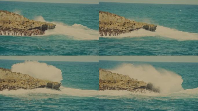 凶猛的海浪冲击着夏威夷瓦胡岛檀香山岩石海岸上的巨石