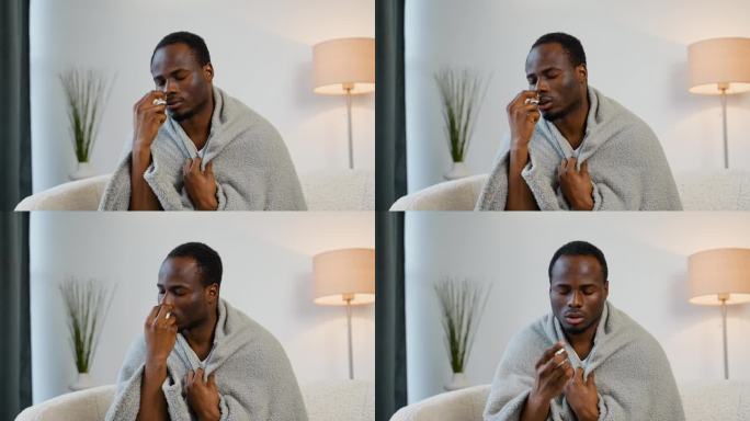 一名非洲男子坐在沙发上喷鼻喷雾剂。病毒性疾病的概念