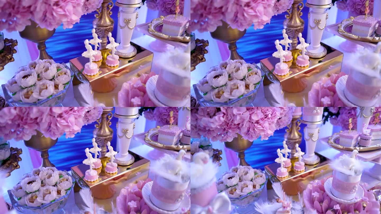 粉色生日派对上的芭蕾舞演员甜桌和装饰天鹅