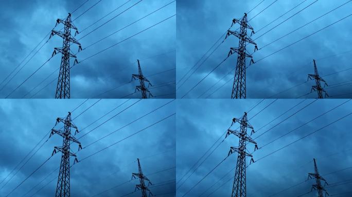 高压输电线路，延时。金属支撑线。天空带着云，黄昏。缺电的概念。