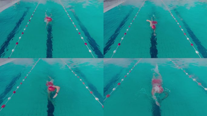 坚定的年轻女子在度假村泳池练习自由泳的高角度跟踪镜头