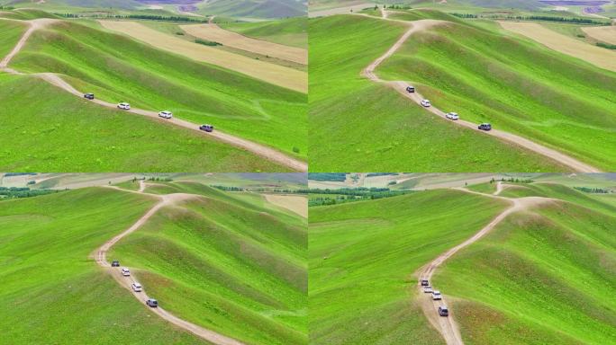 自驾车队行驶在草原山脊上