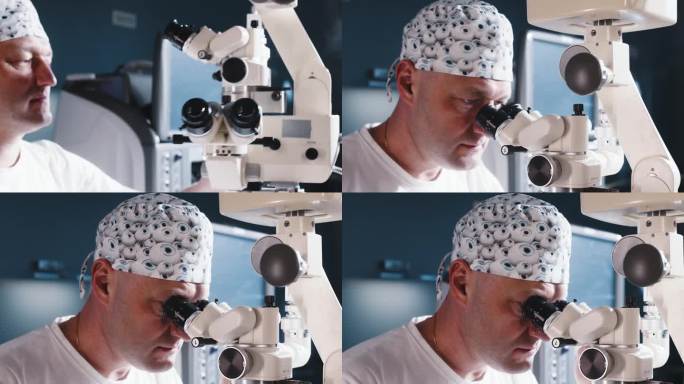 眼科医生坐在显微镜前做手术。进行高精度手术的男医生。飞激光白内障手术。