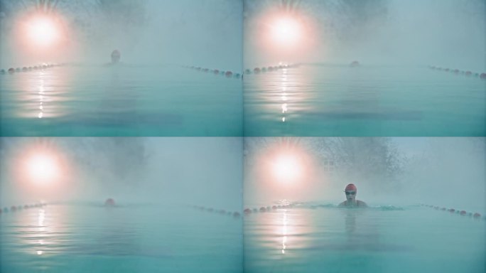 在黎明的大雾天气中，坚定的年轻女子在度假村游泳池游泳的锁定镜头