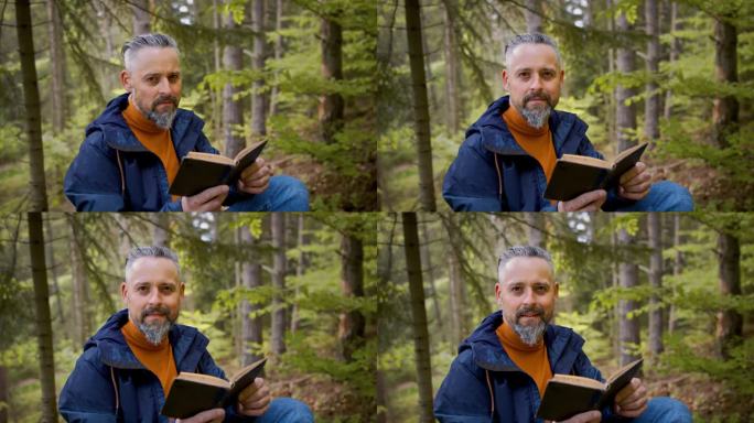成熟的男人在大自然的森林里，坐在户外看书。
