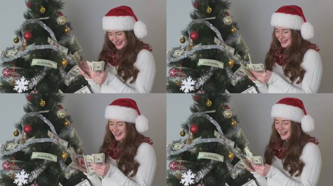 这个女人手里拿着很多钱。数钱，开心。新年的装饰，圣诞树，帽子。审批信贷、贷款、中奖、彩票的概念。