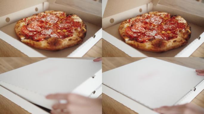 手拿一件件传统的意大利披萨从外卖打开盒子，送餐服务到学生聚会，传统美食，朋友们一起享受美食，近距离观