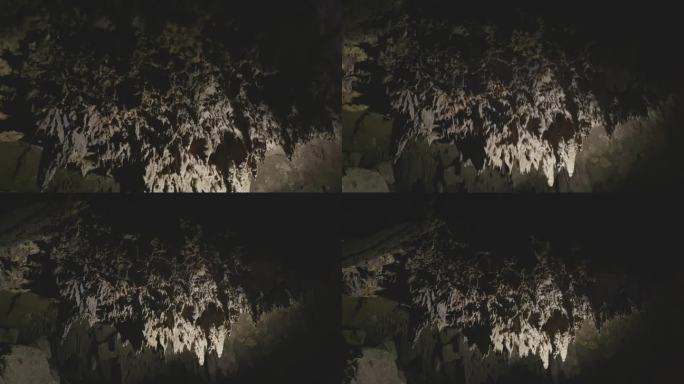 当水从洞穴顶部滴落下来时，洞穴中形成了非常美丽的钟乳石。清莱Tham Luang洞。