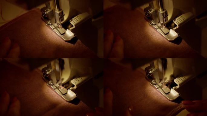 包边缝纫机在织物上缝制下摆。用包边缝纫机进行精密折边，展示了详细的缝合。