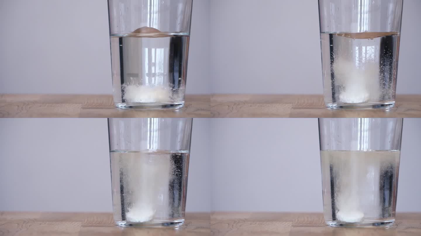 将药片放入一杯水中。速溶维生素片或药片在一杯水中起泡