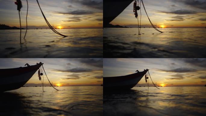 在泰国，一艘船的锚绳在海水中摇摆