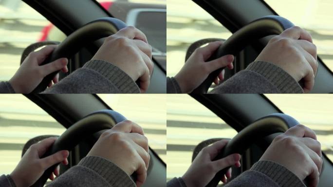 Hands Of Woman Driving Car On Highway: closeup Whe