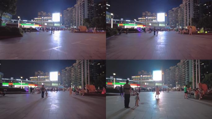 夜晚广场众多行人散步