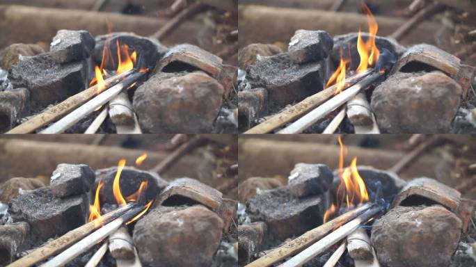 火在小屋里的石炉里烧木柴