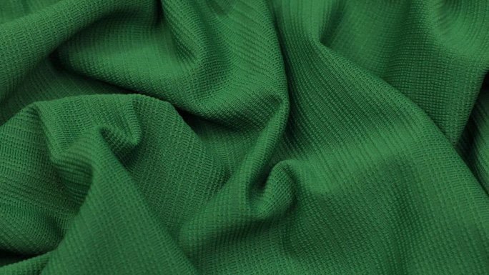 绿色织物。布。绿布波浪背景纹理。