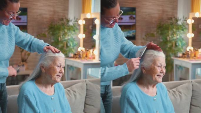 一个中年的女儿在家里给一位80年代的老人梳头发