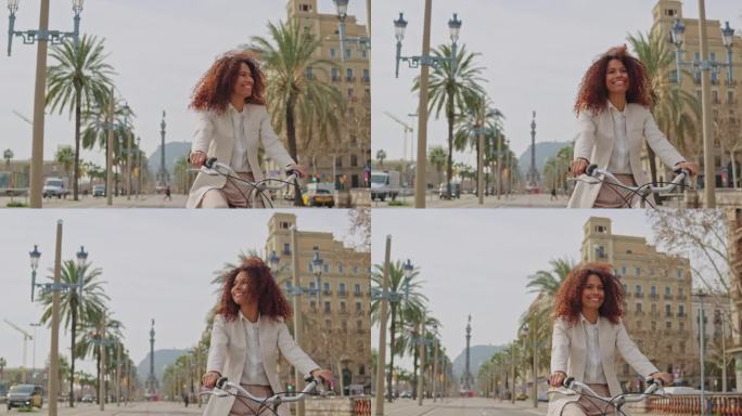 女游客骑自行车游览巴塞罗那的热门旅游景点