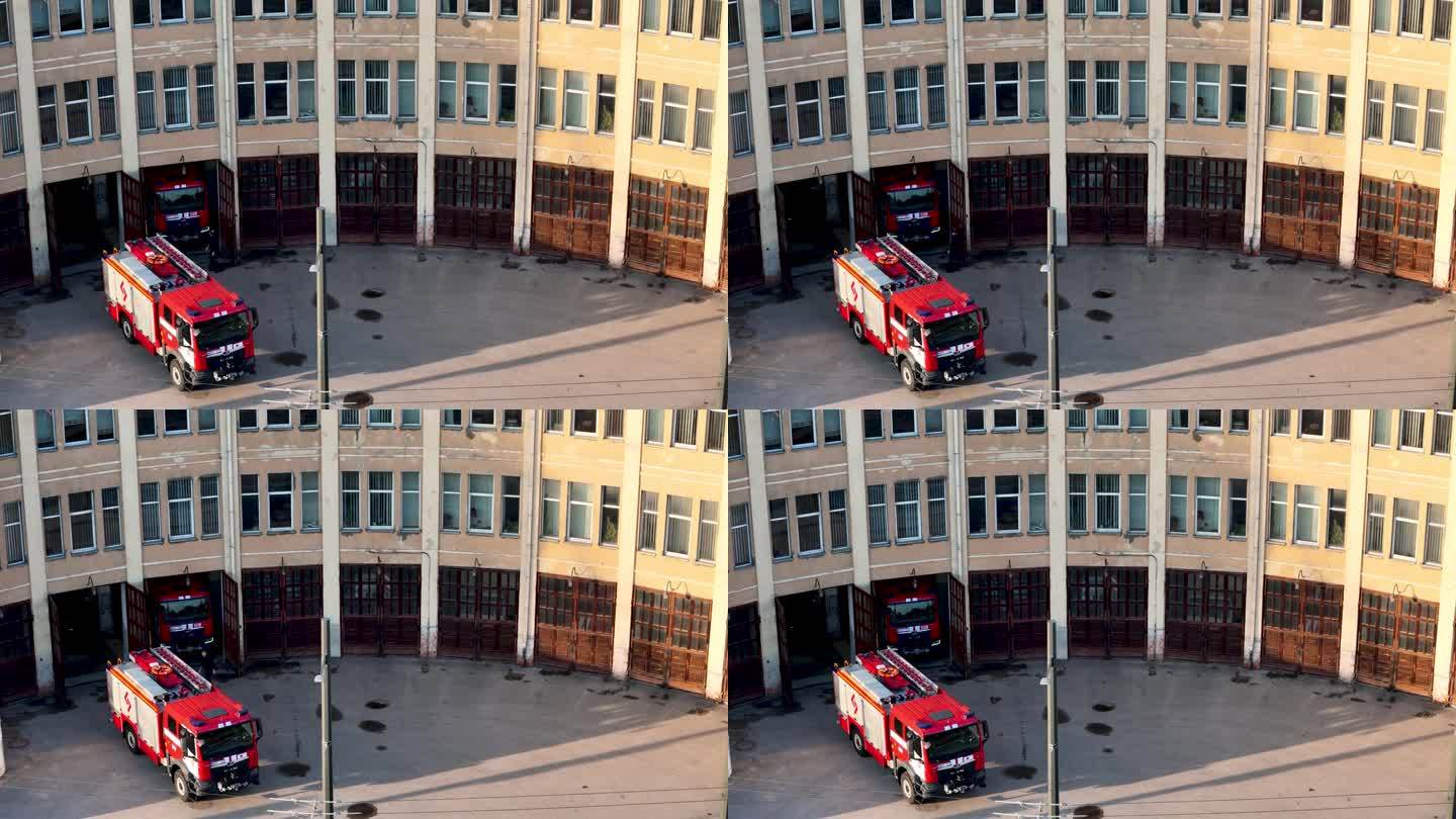 旧消防站大楼的4K航拍视频，院子里有消防车
