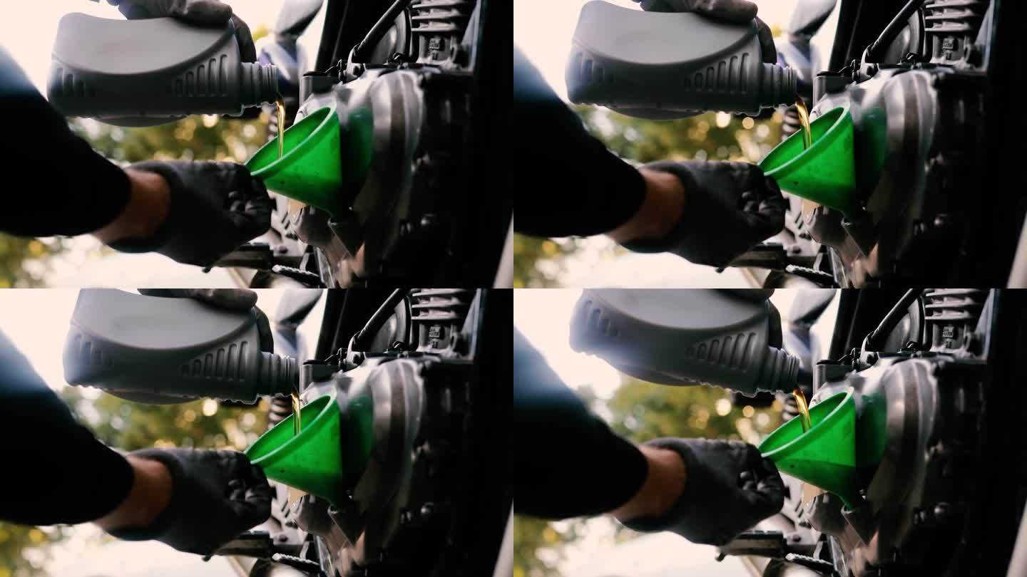给摩托车换机油，给摩托车倒新机油