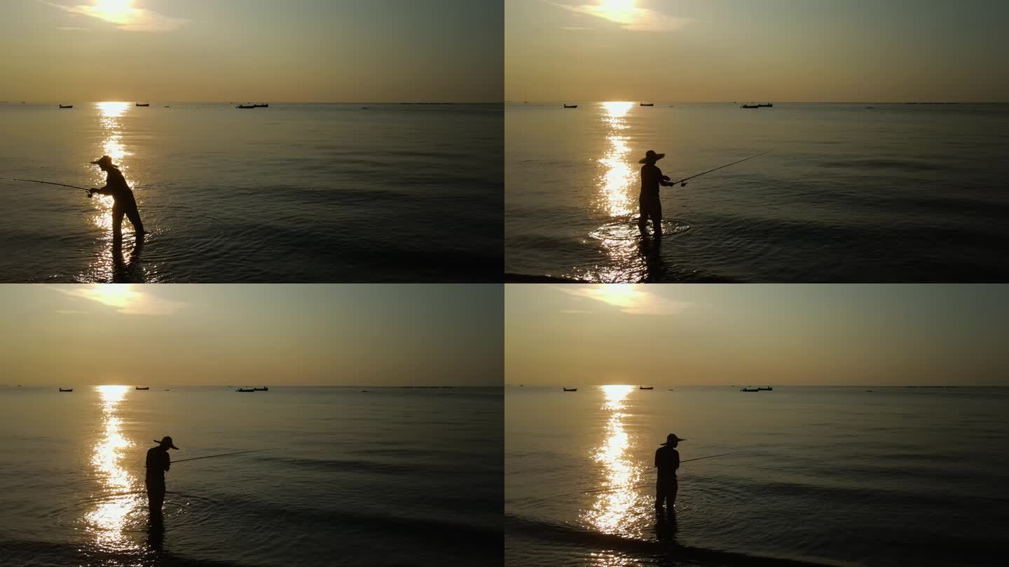 夕阳下海边钓鱼