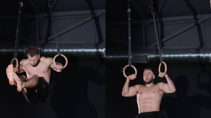 垂直视频。一名男性健美运动员或锻炼者正在健身房的圆环上锻炼