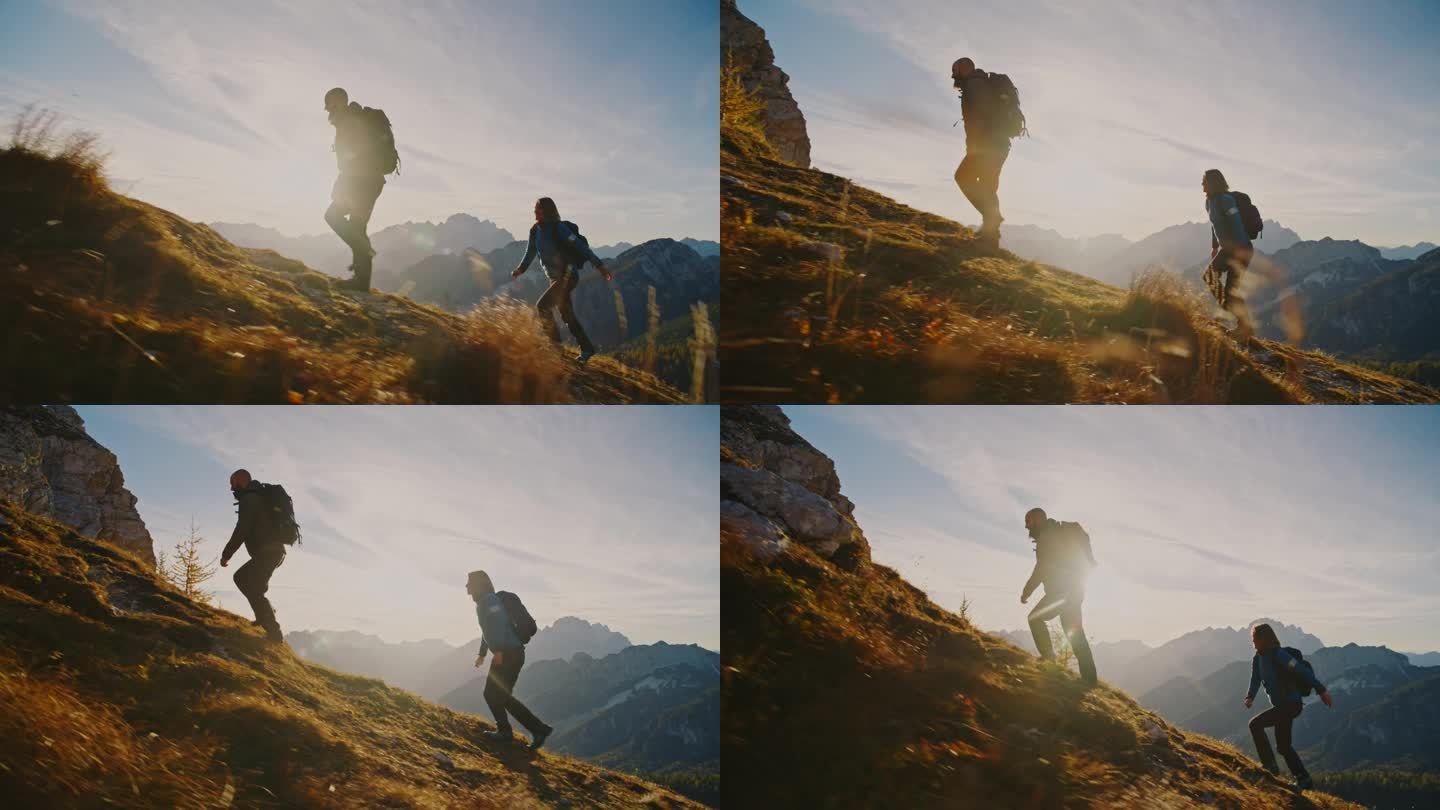 一起攀登:一对夫妇在日落时分征服高山