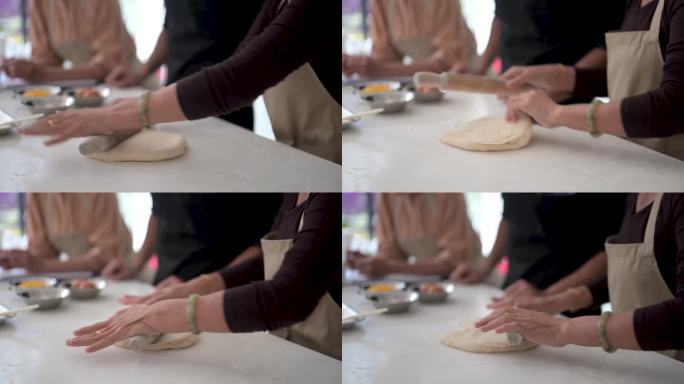 动手学习:亚洲厨师与成人学生分享面食的秘密