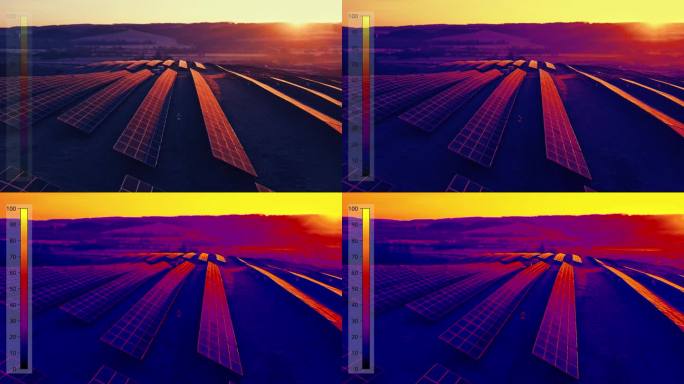 在夕阳下，工程师在农村的太阳能发电厂行走的热视摄像机无人机拍摄的航拍转换