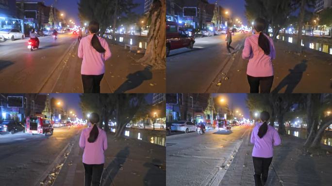一名女子在夜间拥挤的城市街道上慢跑