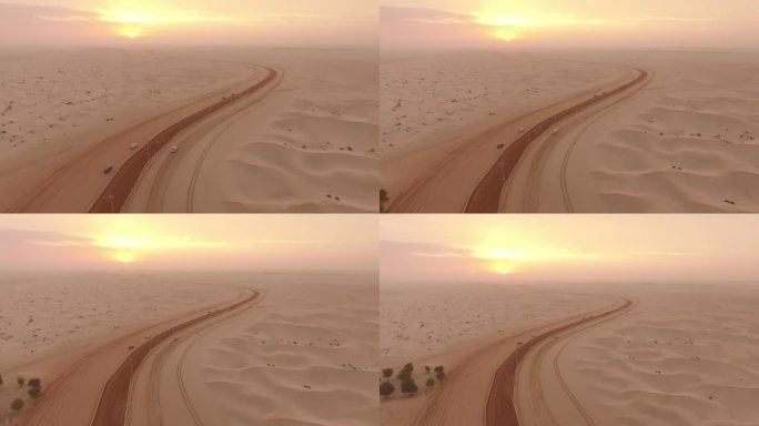 阿布扎比沙漠日落鸟瞰图。沙地耐力赛道导致消失的太阳;马沿着小路出现。