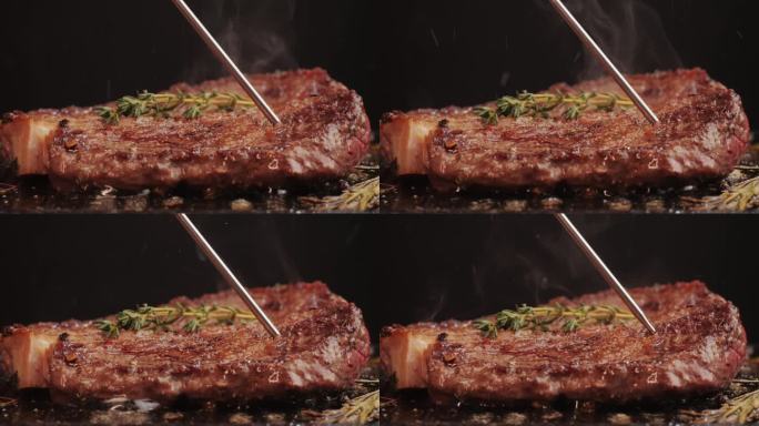 新鲜的大理石牛肉与胡椒，盐和迷迭香特写特写。在烤架上用油烹调多汁的牛排。优质有机和牛肉