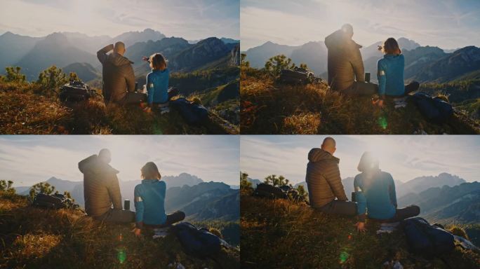 SLO MO山顶峰宁静:背包客在阿尔卑斯山的辉煌中休息，他们尽情享受周围山峰和山谷的全景